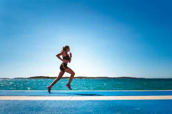 Woman running showing strong leg muscle Abingdon